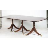 A GEORGE III STYLE TRIPLE PILLAR DINING TABLE