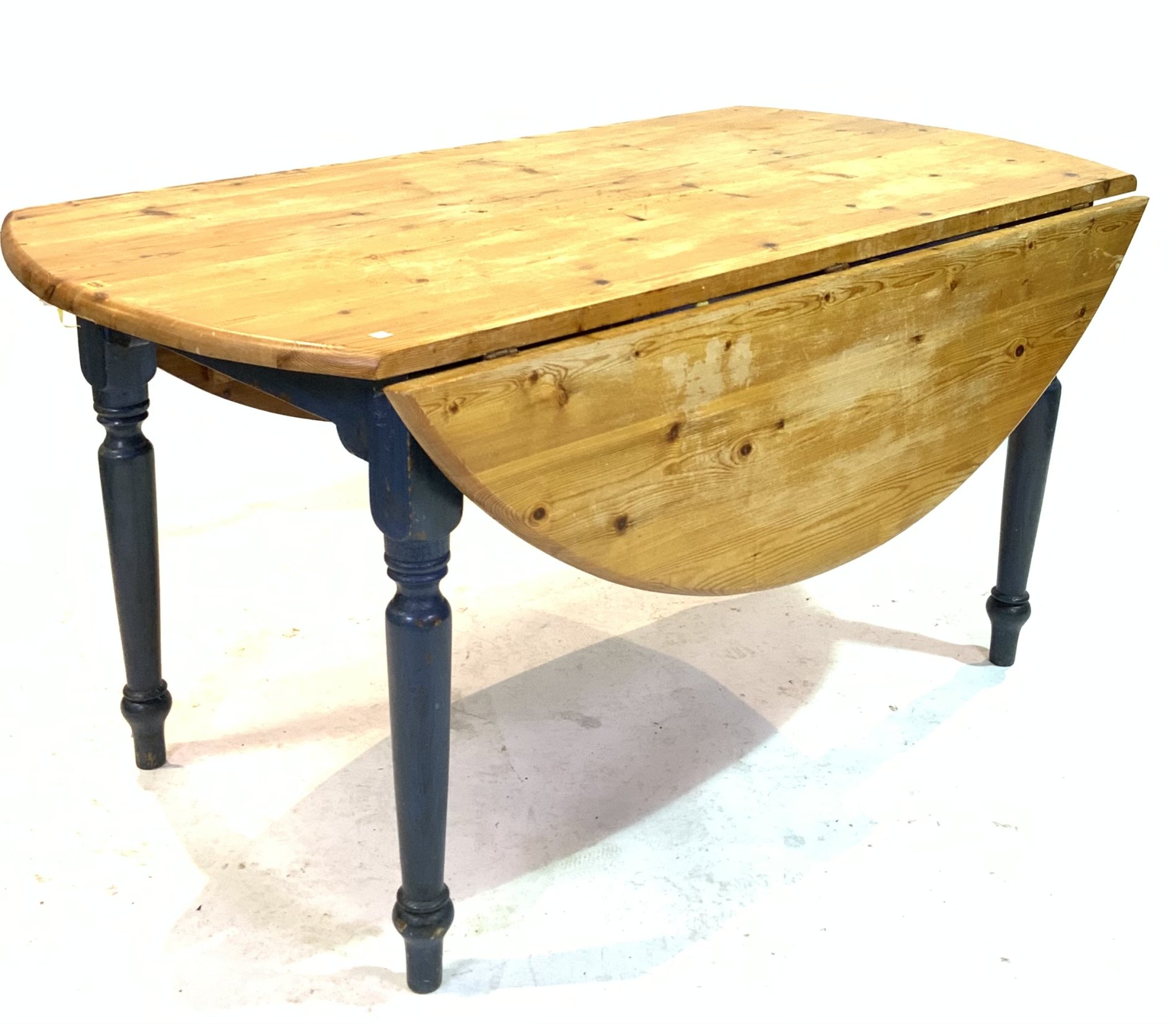 A MODERN BLUE PAINTED PINE DROP-FLAP DINING TABLE