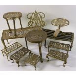 A GROUP OF ELEVEN 19TH CENTURY AND LATER BRASS TRIVET STANDS (11)