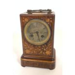 A FRENCH ROSEWOOD AND MARQUETRY INLAID MANTEL CLOCK
