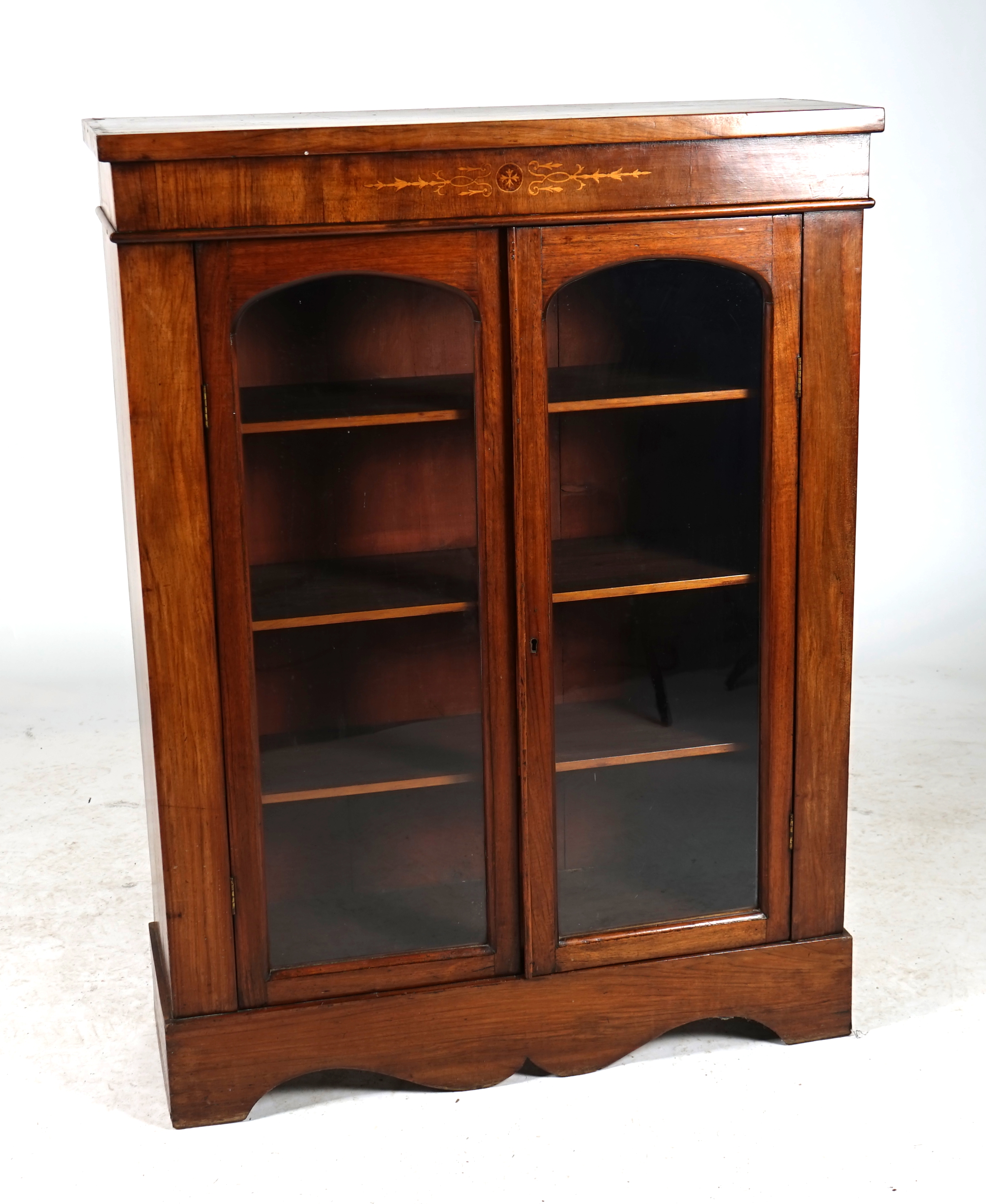 A VICTORIAN WALNUT DISPLAY CABINET