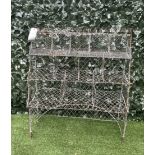 AN EARLY 20TH CENTURY WIREWORK FOUR TIER PLANT STAND