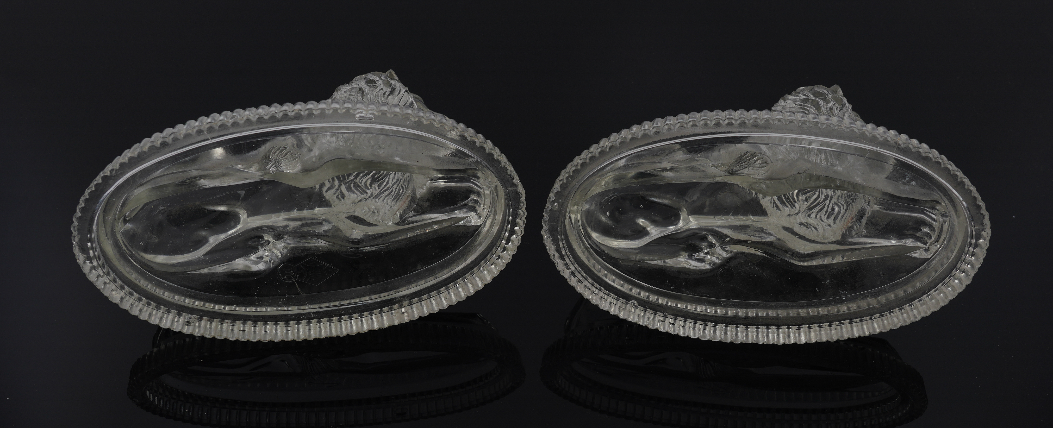JOHN DERBYSHIRE: A PAIR OF VICTORIAN PRESSED GLASS RECUMBENT LIONS (2) - Image 4 of 4