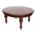 A VICTORIAN MAHOGANY OVAL EXTENDING DINING TABLE