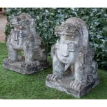 A PAIR OF EASTERN CARVED GRANITE FIGURES OF SEATED DOGS OF FO (2)