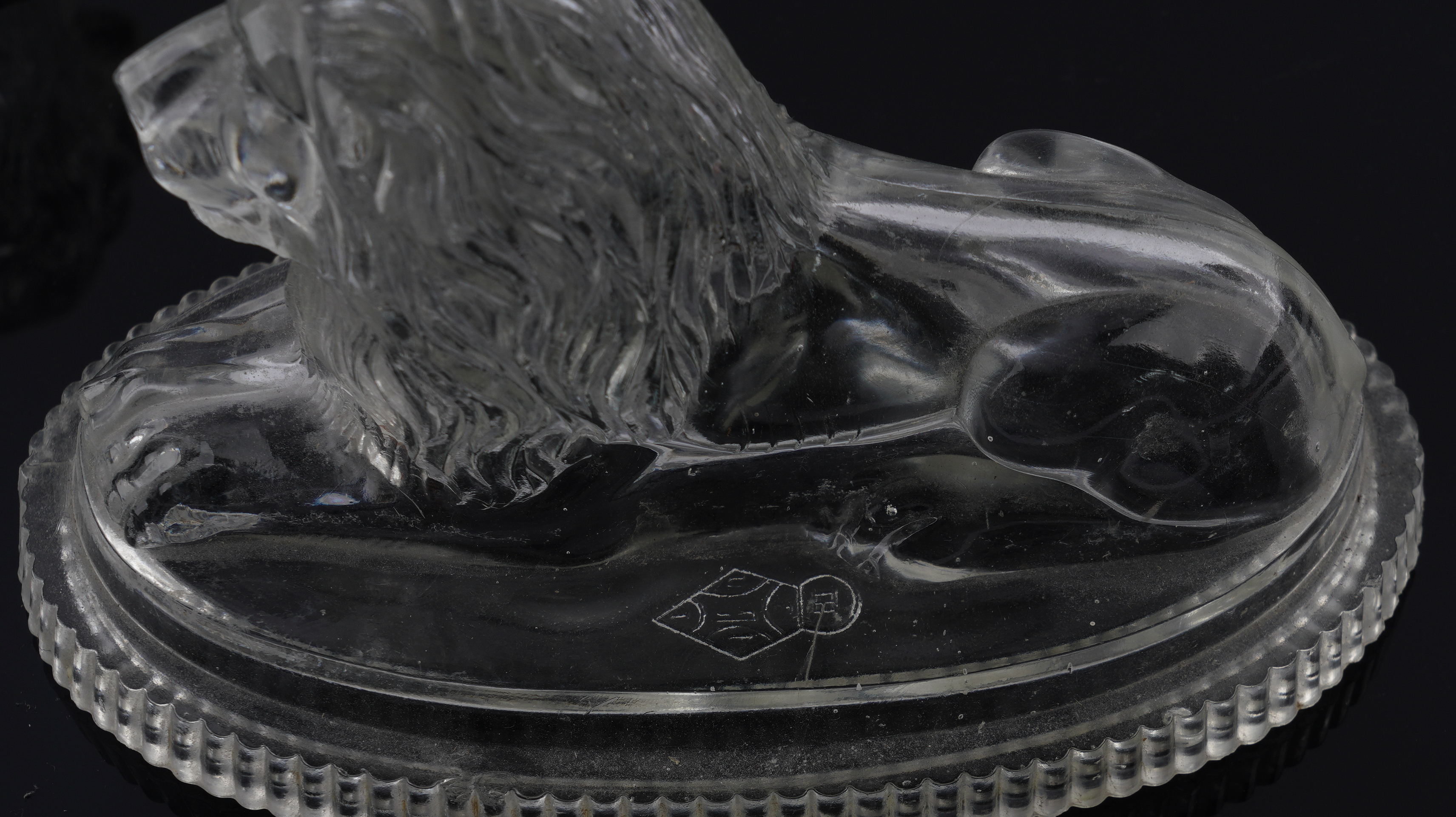 JOHN DERBYSHIRE: A PAIR OF VICTORIAN PRESSED GLASS RECUMBENT LIONS (2) - Image 3 of 4