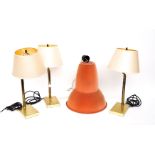 A GROUP OF THREE BRASS LACQUERED TABLE LAMPS WITH ARTICULATING ARMS (4)
