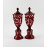 A PAIR OF BOHEMIAN FLASH-RUBY GLASS URNS AND COVERS (2)