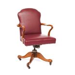 HILLCREST; A LEATHER UPHOLSTERED OPEN ARM DESK SWIVEL CHAIR