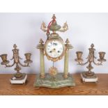 A 19TH CENTUEY ONYX AND GILT METAL MOUNTED MANTEL CLOCK, A PAIR CANDELABRA AND A BRONZE...