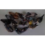 A GROUP OF FIFTEEN MOSTLY WOODEN CARVED DUCKS (15)