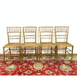 A SET OF FOUR GOLD PAINTED FAUX BAMBOO CHAIRS (4)