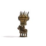 AN INDIAN BRASS CANDLE HOLDER