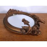 A GEORGE III STYLE GILT FRAMED WALL MIRROR