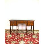 A VICTORIAN MAHOGANY LEATHER TOPPED WRITING TABLE