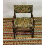 AN 18TH CENTURY STYLE OAK OPEN ARMCHAIR