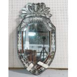 AN EARLY 20TH CENTURY VENETIAN SHIELD SHAPED WALL MIRROR