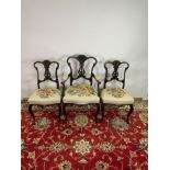 A PAIR OF CARVED MAHOGANY EDWARDIAN SIDE CHAIRS AND AN ARMCHAIR (3)