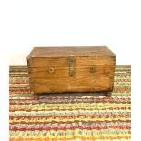 A LATE 19TH CENTURY BRASS BOUND TEAK TRUNK