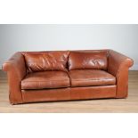 HEALS; A TAN LEATHER UPHOLSTERED THREE SEATER SOFA