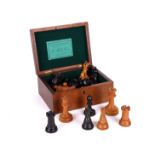 JAQUES & SONS, LONDON: A VICTORIAN STAUNTON PATTERN WEIGHTED BOXWOOD AND EBONY CHESS SET AND BOX