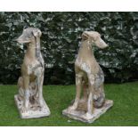A PAIR OF FAUX LEAD PAINTED GESSO SEATED WHIPPETS (2)