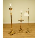 A BRASS HEXAGONAL BASED READING LAMP, A BRASS STANDARD LAMP WITH MARBLE TABLE AND ANOTHER LAMP...