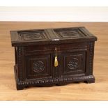 A SMALL 17TH CENTURY CARVED OAK PANELLED COFFER