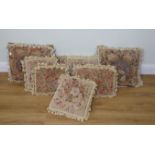 A GROUP OF EIGHT VARIOUS NEEDLEPOINT CUSHIONS WITH TASSELLED FRINGES (8)