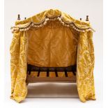 A 20TH CENTURY NOVELTY CAT/DOLL’S BED FORMED AS A BOBBIN TURNED FOUR POSTER BED