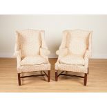 A PAIR OF GEORGE II STYLE SHAPED WINGBACK ARMCHAIRS (2)