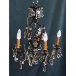 A FRENCH LOUIS XV STYLE WROUGHT IRON AND GLASS FIVE LIGHT CHANDELIER