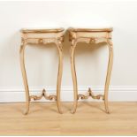 A PAIR OF MID 20TH CENTURY PARCEL-GILT CREAM PAINTED SINGLE DRAWER CONSOLE TABLES (2)