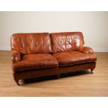 A MODERN STUDDED BROWN LEATHER UPHOLSTERED THREE SEATER SOFA (2)