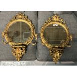 A PAIR OF GEORGE III STYLE GOLD PAINTED GURIDON WALL MIRRORS (2)