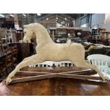 AN EARLY 20TH CENTURY ROCKING HORSE