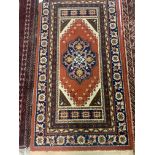 A BELUCHISTAN RUG , A MACHINE MADE RUG, A SOUTH PERSIAN PATCHWORK RUG (3)