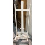 A MODERN WHITE PAINTED ARTIST'S EASEL