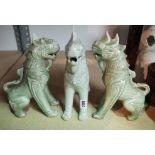 A GROUP OF THREE MODERN CELADON GLAZED DOGS OF FO (3)