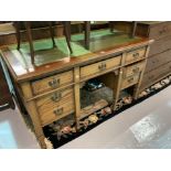 AN EDWARDIAN MAHOGANY SEVEN-DRAWER DESK