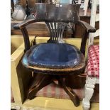 AN EARLY 20TH CENTURY OAK FRAMED OFFICE ARMCHAIR