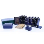 FOUR PAIRS OF GILT DECORATED AND LEATHER FAUX BOOK BOOKENDS TOGETHER WITH FIVE CASKETS AND...
