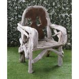 A LARGE DRIFTWOOD GARDEN OPEN ARMCHAIR