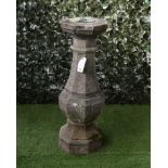 A RECONSTITUTED STONE SUNDIAL ON OCTAGONAL BALUSTER COLUMN