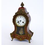 A FRENCH GILT-METAL MOUNTED RED TORTOISESHELL AND BRASS MARQUETRY ‘BOULLE’ MANTEL CLOCK