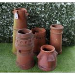 FOUR VARIOUS CIRCULAR TERRACOTTA CHIMNEY POTS (5)