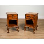 A PAIR OF FIGURED WALNUT TWO DRAWER BEDSIDE TABLES (2)