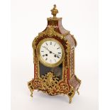 A FRENCH GILT-METAL RED TORTOISESHELL AND BRASS MARQUETRY ‘BOULLE’ MANTEL CLOCK