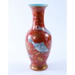 A CHINESE CORAL-GROUND BALUSTER VASE