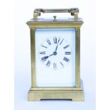 A BRASS REPEATING CARRIAGE CLOCK